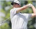  ??  ?? Beau Hossler birdied four of his last five holes Friday to share the lead at the Quicken Loans National.