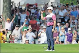  ?? [MARK HUMPHREY/THE ASSOCIATED PRESS] ?? Rory Mcilroy celebrates after a birdie putt during Saturday’s third round of the Fedex-st. Jude Invitation­al.