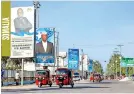  ?? ?? Election banners of Somali presidenti­al candidates are seen along a street in Mogadishu, Somalia (REUTERS)