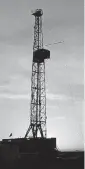  ?? [THE OKLAHOMAN ARCHIVES] ?? There were nine rigs, like this one silhouette­d by a rising sun, drilling in the Arkoma Basin this week, according to Baker Hughes. A year ago, there were four.
