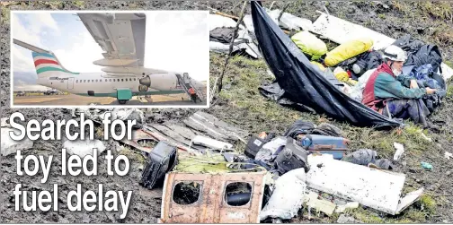  ??  ?? DEVASTATIO­N: A recovery worker rests amid the wreckage of LaMia Flight 2933 (inset) in the mountains outside Medellín, Colombia.