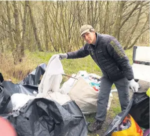  ??  ?? Blitz Ranger Gareth Kett tackles litter in the national park