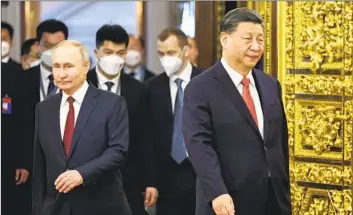  ?? Mikhail Tereshchen­ko Kremlin Pool Photo ?? RUSSIAN PRESIDENT Vladimir Putin, left, and Chinese President Xi Jinping, shown at last year’s meeting at the Kremlin, will hold two days of talks in Beijing. Putin has taken a deferentia­l tone toward his host.