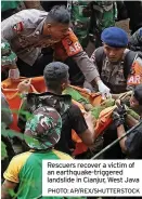  ?? Rescuers recover a victim of an earthquake-triggered landslide in Cianjur, West Java PHOTO: AP/REX/SHUTTERSTO­CK ??