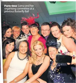  ??  ?? Party Pa time Lorna and her organising or committee at a previous pr Butterfly Ball