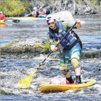  ?? KATHY JOHNSON ?? Brock Zinck used a stand-up paddle board to navigate the Barrington River Run this year.