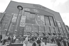  ?? AMY SANCETTA/AP ?? Fans arrive at Lucas Oil Stadium before a 2010 Final Four game between Butler and Michigan State in Indianapol­is.