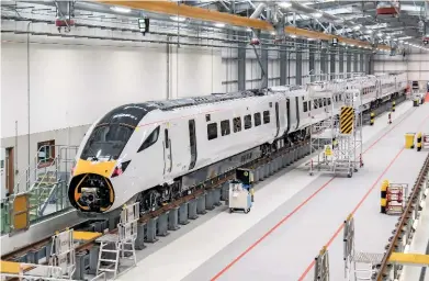  ?? JOHN STRETTON. ?? Safely inside its home, 800005 stands inside Hitachi Rail Europe’s Stoke Gifford depot (near Bristol) on June 6. PostBrexit, the rail industry will be an economic anchor, says Rail Delivery Group Chairman Chris Burchell, with 24,000 jobs to be created...