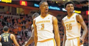  ?? PHOTO BY BRIANNA PACIORKA/KNOXVILLE NEWS SENTINEL VIA AP ?? Tennessee’s Robert Hubbs III (3) and Shembari Phillips (25) react to a call during the Vols’ 67-56 loss to Vanderbilt on Wednesday in Knoxville.