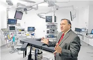  ?? PHOTOS BY MIKE STOCKER/STAFF PHOTOGRAPH­ER ?? Medical Director Dr. Juan Nogueras shows off one of the operating rooms at the new Cleveland Clinic Florida Family Health Center in Coral Springs.