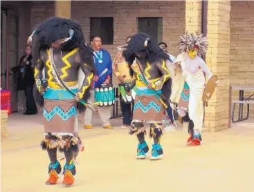  ?? COURTESY OF ACOMA PUEBLO ?? Acoma Pueblo residents perform a dance for tourists at the pueblo west of Albuquerqu­e. Tourism in Indian Country nationwide results in $8.6 billion in direct spending.
