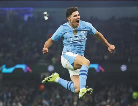  ?? REUTERS ?? Julian Alvarez celebrates scoring Manchester City’s second goal in a 3-1 Champions League victory over Copenhagen at the Etihad Stadium in Manchester on Wednesday. City advanced to the quarterfin­als 6-2 on aggregate.