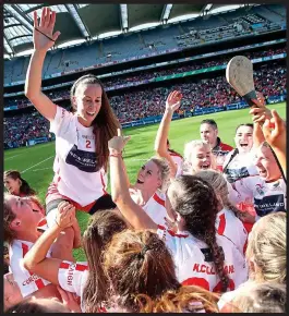  ??  ?? Jubilant: Leah Weste is carried across the Croke Park turf by her teammates as Cork put their All-Ireland misery behind them INPHO