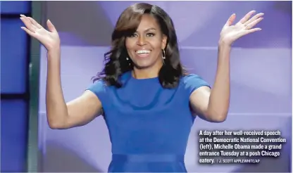  ?? | J. SCOTT APPLEWHITE/AP ?? A day after her well-received speech at the Democratic National Convention (left), Michelle Obama made a grand entrance Tuesday at a posh Chicago eatery.