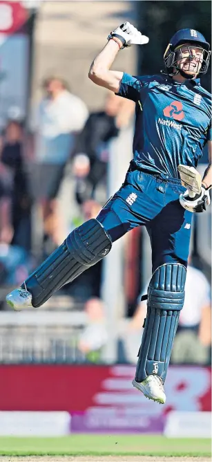  ??  ?? Lionhearts: Jos Buttler jumps for joy after securing England’s victory and captain Eoin Morgan shows off the series trophy as Australia look on