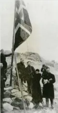  ??  ?? Norwegian whaling captain’s wife Caroline Mikkelsen raises the flag on an Antarctic island in 1935.