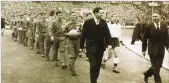  ??  ?? BIG DAY: Top, the 1961 FA Cup programme. Left, managers Matt Gillies (Leicester City) and Bill Nicholson (Spurs) lead the teams out at Wembley