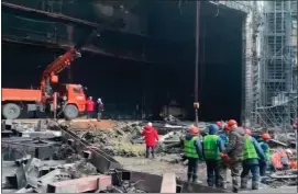  ?? RUSSIAN EMERGENCY MINISTRY PRESS SERVICE VIA THE ASSOCIATED PRESS ?? Rescuers work in the burned concert hall after a terrorists attack on the building of the Crocus City Hall on the western edge of Moscow, Russia.