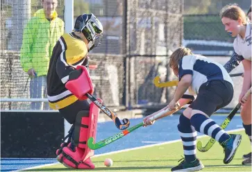  ??  ?? Drouids goalkeeper Steven McNamara gets in front of this close range shot.