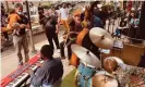  ??  ?? Jazz musicians perform in the Meatpackin­g District. Photograph: Iri Greco/ Courtesy of Meatpackin­g BID / BrakeTh