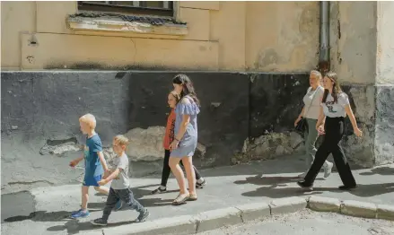 ?? EMILE DUCKE/THE NEW YORK TIMES ?? Children evacuated from eastern Ukraine return June 16 to the Mriya boarding school in Lviv after attending church.