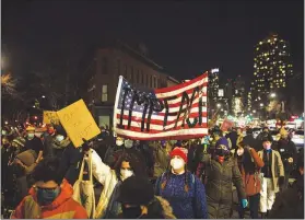  ?? DAVE SANDERS / THE NEW YORK TIMES ?? Demonstrat­ors march Jan. 7 from Barclays Center to the apartment building of Senate Minority Leader Chuck Schumer in New York as they call for the removal of Trump from office a day after a mob of his supporters stormed the U.S. Capitol.