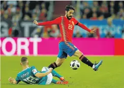  ?? Picture: Reuters ?? Spain’s Isco beats a tackle by Germany’s Joshua Kimmich on Friday.