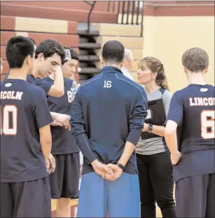  ?? Photos by Jerry Silberman / risportsph­oto.com ?? Lincoln coach Jane Fish (grey shirt) talks to her team during Wednesday night’s Division II firstround loss to East Greenwich. It was Lincoln’s first playoff appearance since 2009.