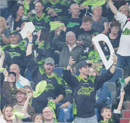  ?? KAYLE NEIS ?? Saskatchew­an Rush fans celebrate after a goal against the Georgia Swarm during Game 2 of the NLL championsh­ip series at SaskTel Centre in Saskatoon on Saturday. Saskatoon’s small-city model is being looked at for future expansion, the league says.