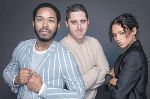  ?? Brian van der Brug Los Angeles Times ?? “WAVES” costars Kelvin Harrison Jr. and Taylor Russell f lank writer-director Trey Edward Shults, who says the film’s story is a personal one.