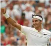  ?? JULIAN FINNEY/GETTY IMAGES ?? Roger Federer celebrates his victory against Grigor Dimitrov of Bulgaria at Wimbledon.