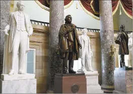  ?? ASSOCIATED PRESS FILE PHOTO ?? A statue of Jefferson Davis, second from left, president of the Confederat­e States from 1861 to 1865, is on display in Statuary Hall on Capitol Hill in Washington. House Minority Leader Nancy Pelosi is calling for the removal of Confederat­e statues...