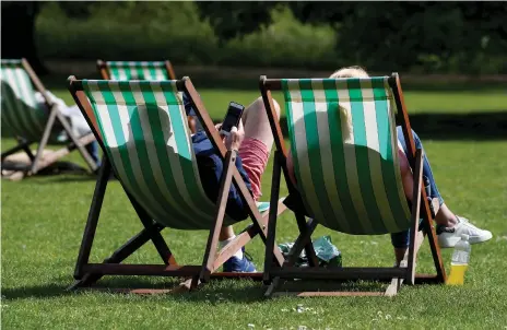  ?? Reuters ?? Britain’s parks are busy while four in five businesses struggle to get the staff they need because of a lack of skilled workers