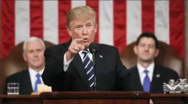  ?? JIM LO SCALZO — POOL IMAGE VIA AP ?? President Donald Trump addresses a joint session of Congress on Capitol Hill in Washington, Tuesday. Vice President Mike Pence and House Speaker Paul Ryan of Wis. listen.