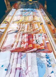  ??  ?? An array of Hermès silk scarves