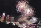  ?? JOSHUA A. BICKEL/COLUMBUS DISPATCH ?? Fireworks explode over the Columbus skyline during Red, White & Boom in 2018.