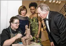  ?? ?? Marilyn and Larry Klaben chat with Wright State University art students Ellen Bukvic (left) and Renika Williams at the 2015 ArtsGala.