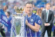  ?? AP ?? Chelsea captain John Terry holds the Premier League trophy in 2017.