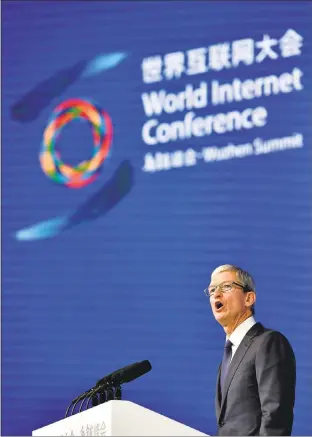  ?? CHINATOPIX VIA AP ?? Apple CEO Tim Cook told conference attendees that his company is proud to work with Chinese partners to build a “common future in cyberspace.”