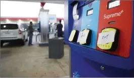  ?? Karen Warren/Washington Post photo ?? Signs that read ‘OUT’ cover a gas pump in North Houston at a Chevron gas station. As people prepared for Harvey, they bought out gas and other supplies.