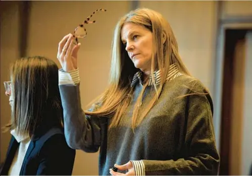  ?? HEARST CONNECTICU­T MEDIA VIA AP ?? Michelle Troconis, on trial for conspiring with late beau Fotis Dulos (below, center), who died by suicide in 2020 while facing charges of killing his estranged wife, Jennifer Farber Dulos, stands in Stamford, Conn., courtroom last week.