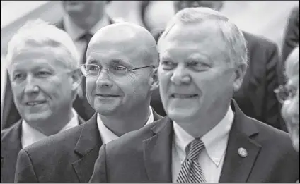  ?? JASON GETZ / JGETZ@AJC.COM ?? State Superinten­dent John Barge’s position on the charter amendment put him on the opposite side of Gov. Nathan Deal (right). Both say they have a great working relationsh­ip, but Barge (center) has heard rumors that some in the GOP, perhaps even Deal,...