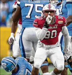  ?? JOSHUA BOUCHER/THE NEWS & OBSERVER VIA AP ?? South Carolina’s Damani Staley (30) reacts Thursday after sacking North Carolina’s Sam Howell during the second half of the Duke’s Mayo Bowl game in Charlotte, N.C.