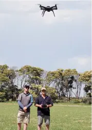  ??  ?? Above: Ellinbank senior technical officer Greg Morris (right) operates a drone under the supervisio­n of Mathew Herbert of Victorian Unmanned Aerial Systems.
Above, right: Dr Marlie Wright hopes to use remote sensors attached to unmanned aerial...