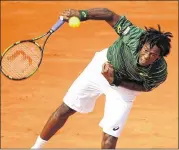  ?? CLIVE BRUNSKILL / GETTY IMAGES ?? Gael Monfils of France gave fans plenty to cheer about on Wednesday at Roland Garros. Monfils won in five sets over Argentina’s Diego Schwartzma­n.