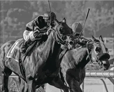  ?? BARBARA D. LIVINGSTON ?? Bal a Bali (left) beats What a View in the Grade 1 Kilroe Mile. He meets that foe again Saturday.