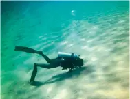  ??  ?? Emirati scuba instructor Faisal J. Al Hammad during a diving.