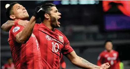  ??  ?? SHANGHAI: Shanghai SIPG’ Brazilian forward Hulk (C) and teammate Elkeson celebrate a goal during the AFC Asian Champions League group football match between China’s Shanghai SIPG and Japan’s Urawa Red Diamonds in Shanghai yesterday. — AFP