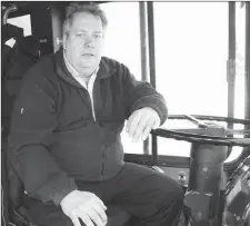  ?? SHARON MONTGOMERY-DUPE - CAPE BRETON POST ?? Doug MacDonald, a bus driver with Transit Cape Breton, waits for passengers on Commercial Street in Glace Bay. CBRM Deputy Mayor George MacDonald confirmed that the expected 200 cuts to Transit Cape Breton service will not take place in 2015.