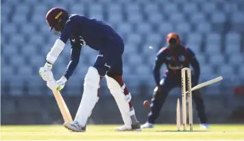  ??  ?? Stumps fly as Chemar Holder and his West Indies team mates prepare for the first Test